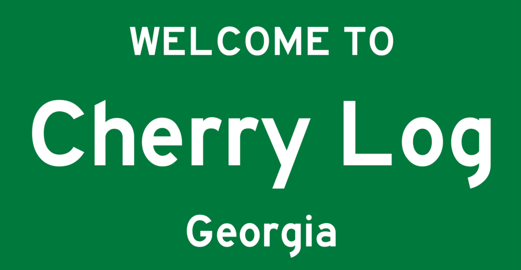 Green Sign Saying Welcome to Cherry Log